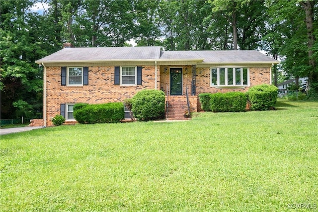 7708 Stonetree Dr, North Chesterfield, VA 23235 - view of front of home with a front lawn, brick siding, and a chimney