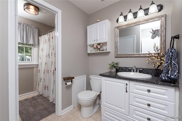 full bathroom with toilet, vanity, a shower with curtain, and tile patterned flooring