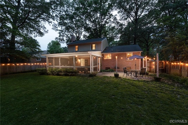 1951 Greenfield Dr, Chesterfield, VA 23235 - back of house featuring a sunroom, a chimney, and a patio