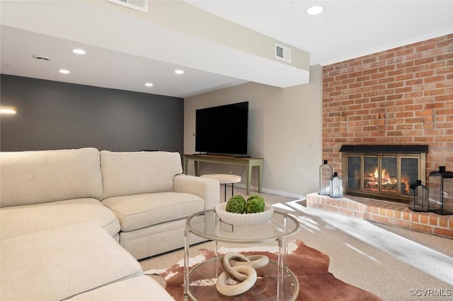 carpeted living area with recessed lighting, a fireplace, and baseboards