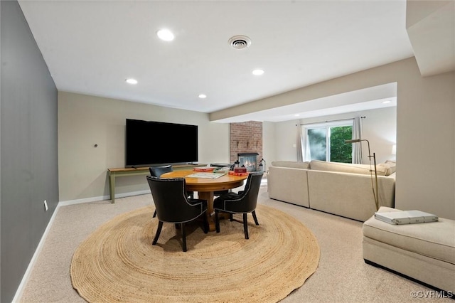 dining space featuring carpet floors, a fireplace, recessed lighting, and baseboards