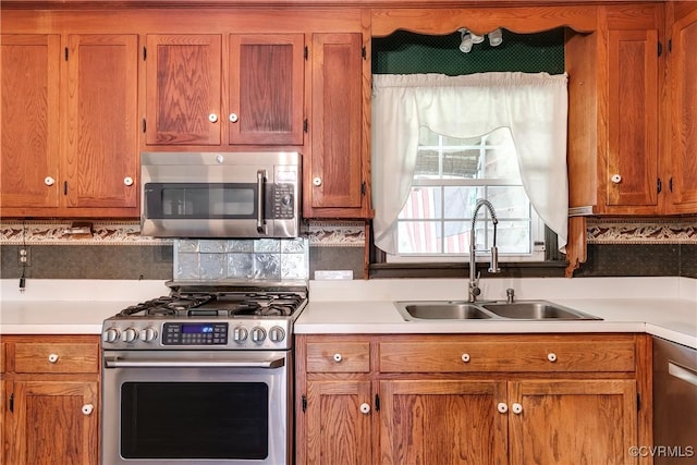 12416 Mount Hermon Rd, Ashland, VA 23005 - kitchen with appliances with stainless steel finishes, a sink, and light countertops