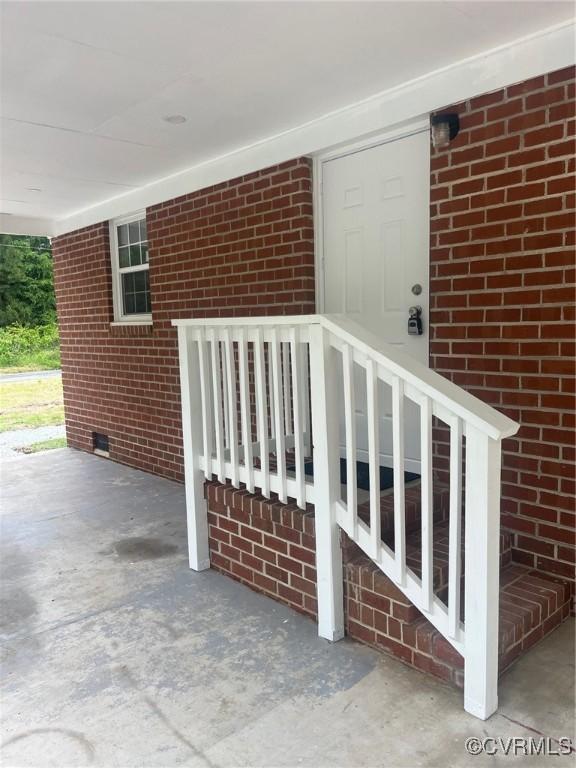 2720 Brunswick Rd, Emporia, VA 23847 - entrance to property with brick siding and crawl space