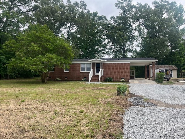 2720 Brunswick Rd, Emporia, VA 23847 - ranch-style house featuring crawl space, gravel driveway, entry steps, a front yard, and a carport