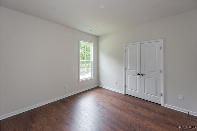5142 Stavely Rd, Chester, VA 23831 - unfurnished bedroom featuring dark wood-type flooring, baseboards, and a closet