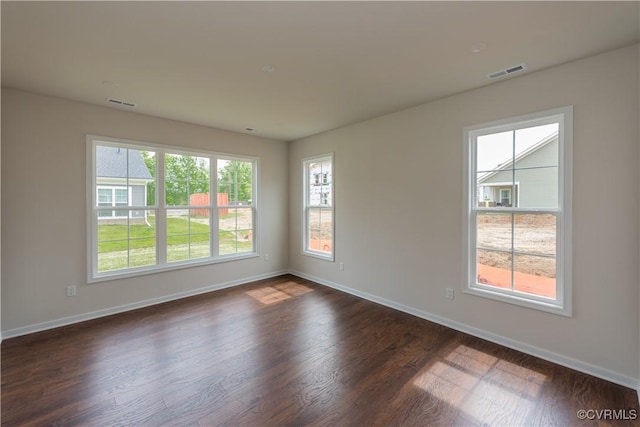 5142 Stavely Rd, Chester, VA 23831 - unfurnished room with healthy amount of natural light, baseboards, and dark wood-style flooring