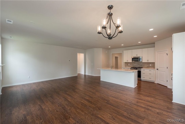 5142 Stavely Rd, Chester, VA 23831 - kitchen with appliances with stainless steel finishes, a chandelier, dark wood-type flooring, white cabinets, and open floor plan