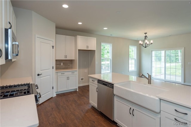 5142 Stavely Rd, Chester, VA 23831 - kitchen featuring appliances with stainless steel finishes, a sink, dark wood-style floors, white cabinets, and a chandelier