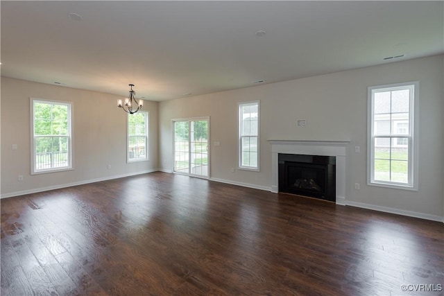 5142 Stavely Rd, Chester, VA 23831 - unfurnished living room with a chandelier, dark wood-type flooring, and healthy amount of natural light