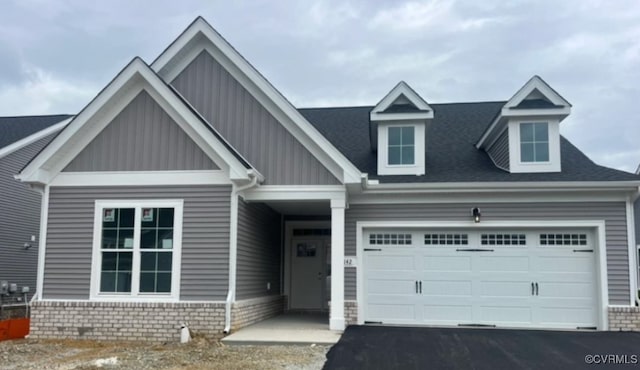 5142 Stavely Rd, Chester, VA 23831 - craftsman house featuring board and batten siding, driveway, a garage, and a shingled roof