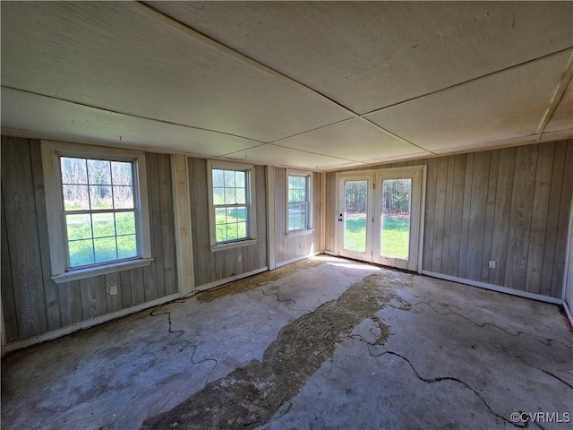 2446 Mantua Rd, Stevensville, VA 23161 - unfurnished room with plenty of natural light, baseboards, and wooden walls