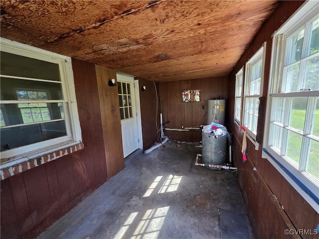 2446 Mantua Rd, Stevensville, VA 23161 - unfurnished sunroom with electric water heater, wood walls, and wood ceiling