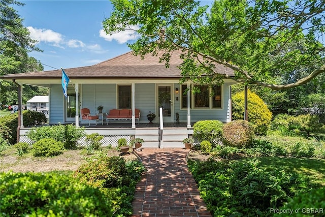 20 Winstead Dr, Irvington, VA 22480 - view of front of house featuring a porch and roof with shingles