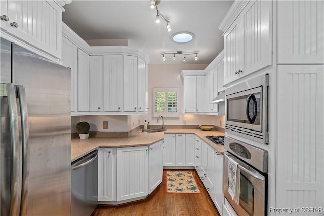 20 Winstead Dr, Irvington, VA 22480 - kitchen with stainless steel appliances, a sink, light countertops, and white cabinets