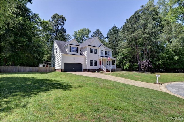 4489 Powhatan Xing, Williamsburg, VA 23188 - view of front facade with driveway, a garage, and view of wooded area