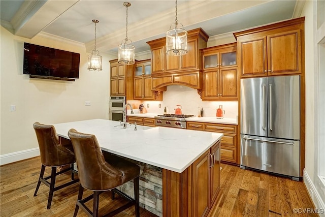 717 Old Stream Rd, Manakin Sabot, VA 23103 - kitchen with stainless steel appliances, a sink, brown cabinetry, light countertops, and crown molding