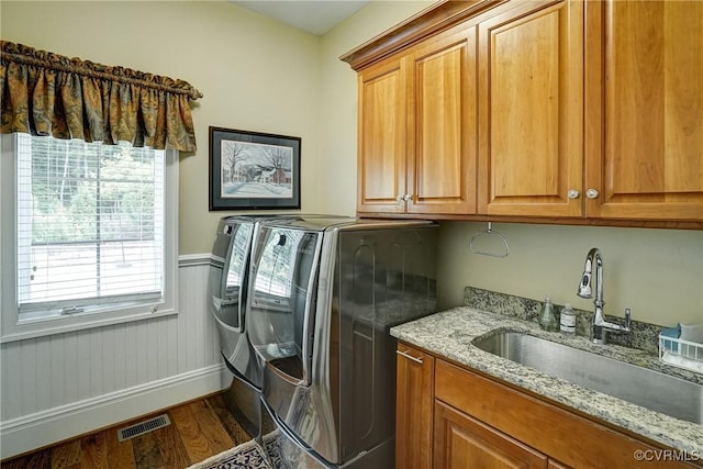 717 Old Stream Rd, Manakin Sabot, VA 23103 - laundry area with washer and clothes dryer, cabinet space, dark wood finished floors, a wainscoted wall, and baseboards