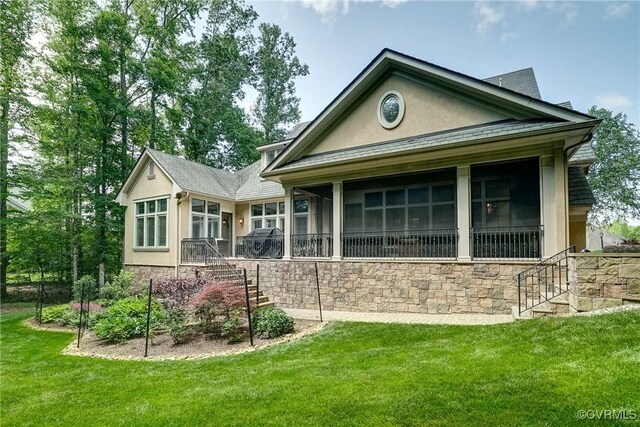 717 Old Stream Rd, Manakin Sabot, VA 23103 - back of property featuring stucco siding, a sunroom, a lawn, stone siding, and stairway