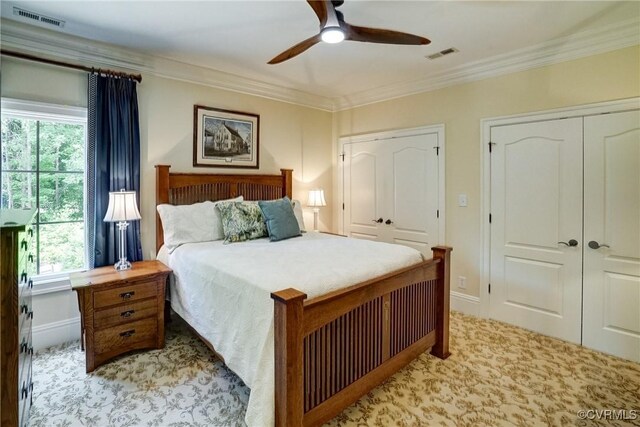 717 Old Stream Rd, Manakin Sabot, VA 23103 - carpeted bedroom with multiple closets, multiple windows, crown molding, and ceiling fan