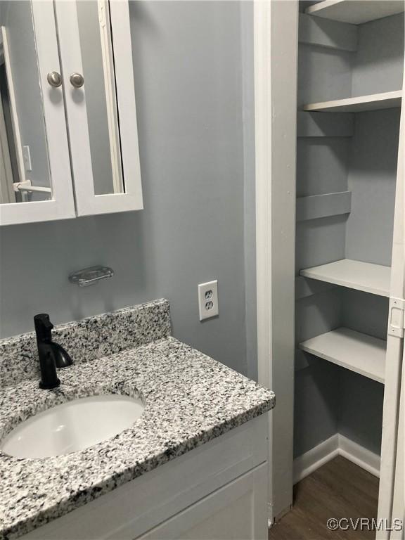 2517 Myron Ave, Chesterfield, VA 23237 - bathroom featuring wood finished floors, vanity, and baseboards