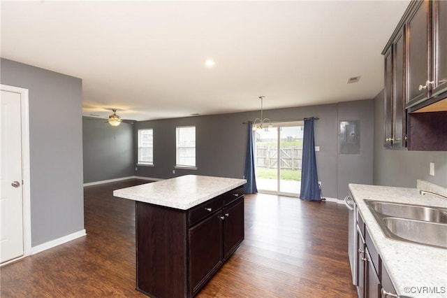 3316 New Heritage Loop, Henrico, VA 23231 - kitchen featuring a sink, light countertops, dark wood finished floors, and dark brown cabinetry