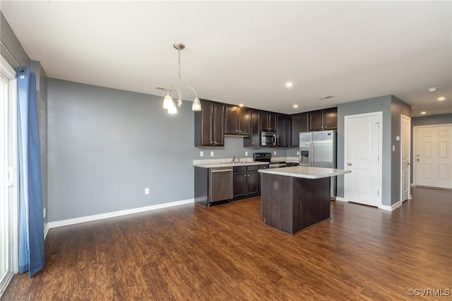 3316 New Heritage Loop, Henrico, VA 23231 - kitchen with appliances with stainless steel finishes, dark brown cabinetry, baseboards, dark wood finished floors, and light countertops