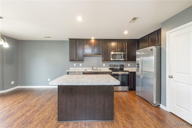 3316 New Heritage Loop, Henrico, VA 23231 - kitchen featuring stainless steel appliances, a sink, dark brown cabinetry, light countertops, and a kitchen island