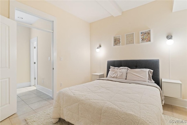 9 E Clay St Unit U2, Richmond, VA 23219 - bedroom featuring tile patterned flooring, beam ceiling, and baseboards