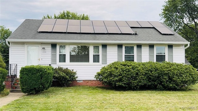 2708 Elgin Rd, Henrico, VA 23223 - view of front facade with solar panels, a front lawn, and roof with shingles