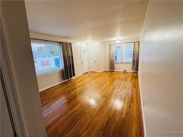 2708 Elgin Rd, Henrico, VA 23223 - unfurnished room with wood finished floors, healthy amount of natural light, and baseboards
