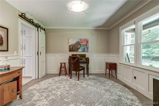 1825 Rock Point Dr, Powhatan, VA 23139 - office area with a decorative wall, a barn door, crown molding, a wainscoted wall, and a textured ceiling