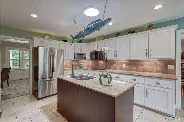 1825 Rock Point Dr, Powhatan, VA 23139 - kitchen with black appliances, a sink, white cabinets, a center island with sink, and recessed lighting