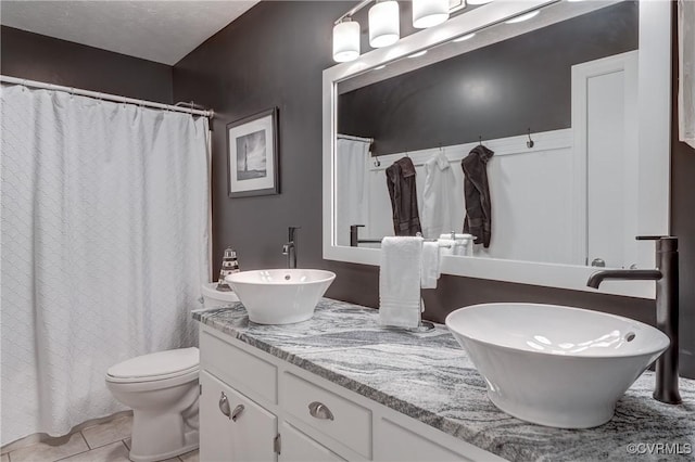 1825 Rock Point Dr, Powhatan, VA 23139 - full bathroom with double vanity, toilet, tile patterned floors, and curtained shower