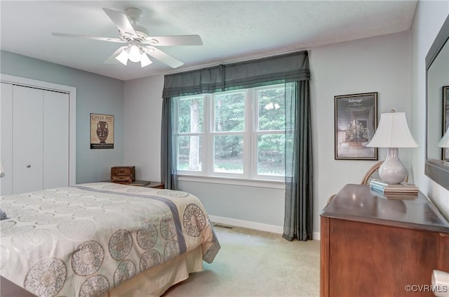 1825 Rock Point Dr, Powhatan, VA 23139 - bedroom with light colored carpet, a closet, baseboards, and a ceiling fan