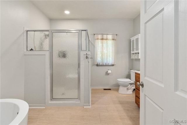 8401 Bethia Rd, Chesterfield, VA 23832 - bathroom featuring a stall shower, toilet, baseboards, vanity, and recessed lighting