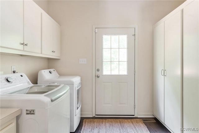 8401 Bethia Rd, Chesterfield, VA 23832 - laundry area featuring washer and dryer, cabinet space, dark wood finished floors, and baseboards