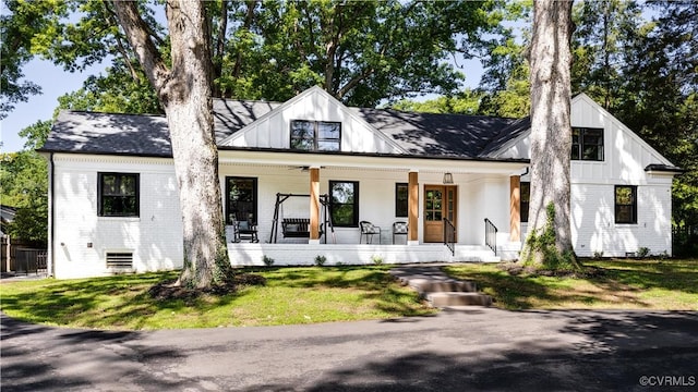 200 N Ridge Rd, Henrico, VA 23229 - modern farmhouse style home featuring brick siding, a porch, and board and batten siding