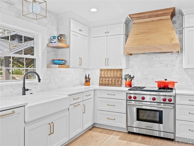 200 N Ridge Rd, Henrico, VA 23229 - kitchen featuring luxury range, premium range hood, a sink, light countertops, and tasteful backsplash