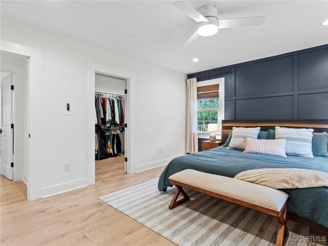 200 N Ridge Rd, Henrico, VA 23229 - bedroom with baseboards, light wood-style floors, a walk in closet, recessed lighting, and a closet
