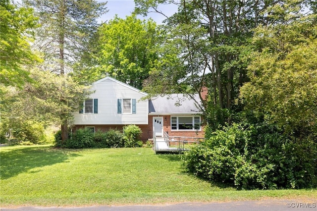 8912 Michaux Ln, Henrico, VA 23229 - split level home featuring brick siding and a front yard