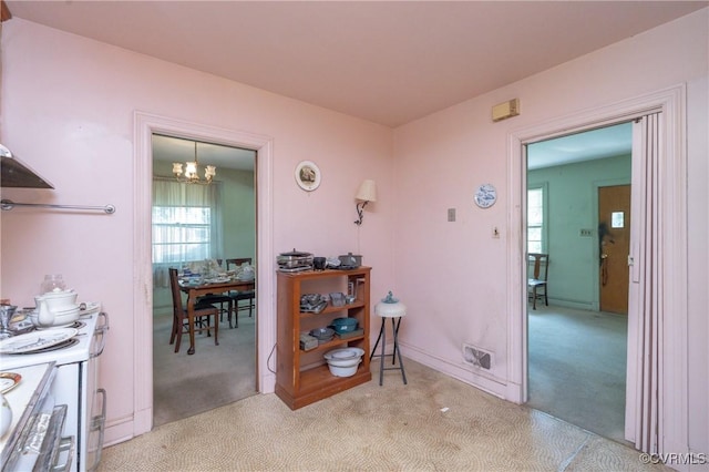 8912 Michaux Ln, Henrico, VA 23229 - corridor with carpet flooring and a chandelier