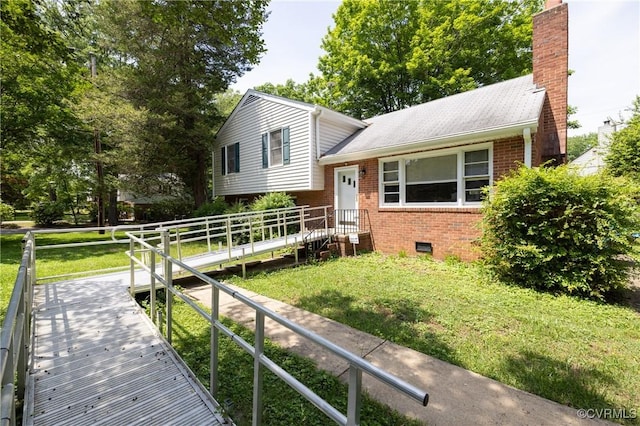8912 Michaux Ln, Henrico, VA 23229 - tri-level home featuring brick siding, a front lawn, and a chimney