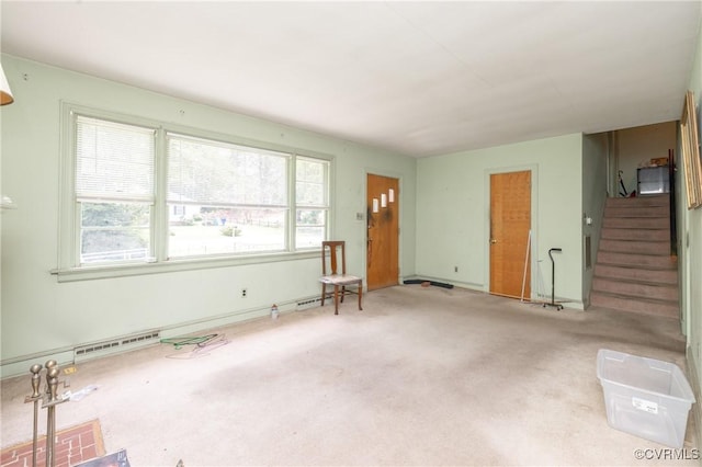 8912 Michaux Ln, Henrico, VA 23229 - unfurnished living room with stairway, carpet floors, and baseboard heating