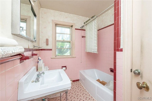 8912 Michaux Ln, Henrico, VA 23229 - bathroom with a sink, tile walls, shower / bathtub combination, and tile patterned floors
