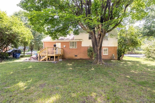 8912 Michaux Ln, Henrico, VA 23229 - rear view of property featuring a wooden deck, brick siding, a lawn, and crawl space