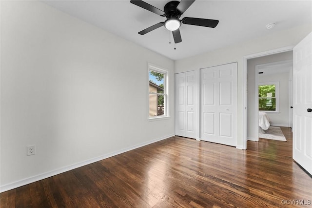 5314 Marian St, Richmond, VA 23226 - unfurnished bedroom with multiple windows, wood finished floors, and multiple closets