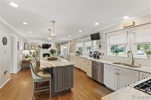 3700 Milbranch Pl, Henrico, VA 23233 - kitchen with stainless steel dishwasher, crown molding, a kitchen island, a sink, and light stone counters