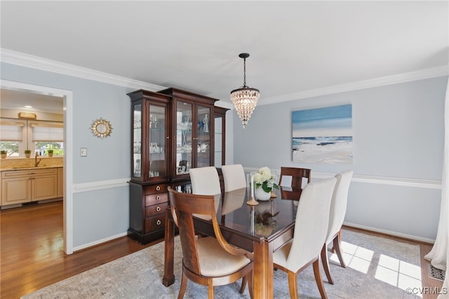 3700 Milbranch Pl, Henrico, VA 23233 - dining area with a chandelier, wood finished floors, crown molding, and baseboards