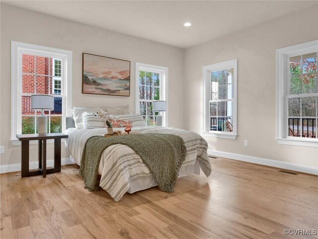 30307 Victoria Way, Petersburg, VA 23805 - bedroom with baseboards, light wood-type flooring, multiple windows, and recessed lighting