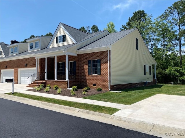 30307 Victoria Way, Petersburg, VA 23805 - view of front of house with a porch, a front yard, crawl space, brick siding, and driveway